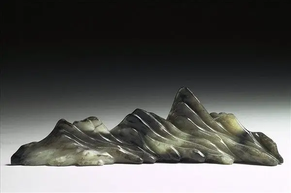 Jade brush rest in the shape of a mountain range by Unknown artist