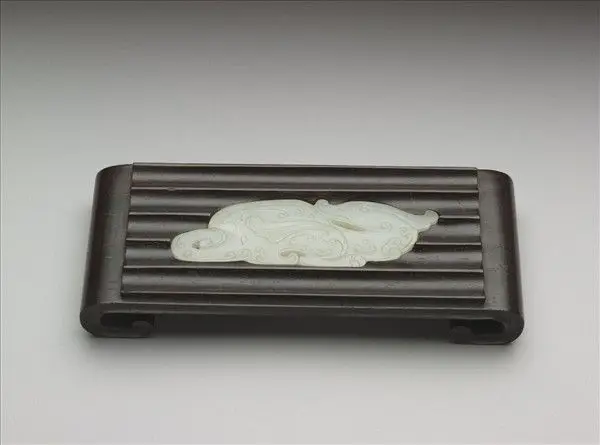 Red sandalwood brush rest with jade inlay by Unknown artist