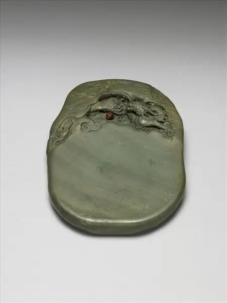 Songhua inkstone with "Dragon Educating the Cub" motif by Unknown artist