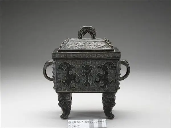 Porcelain rectangular cauldron with animal-mask decoration in imitation of bronze by Unknown artist