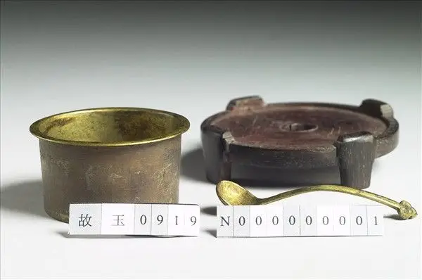 Bronze fitting and ladle by Unknown artist