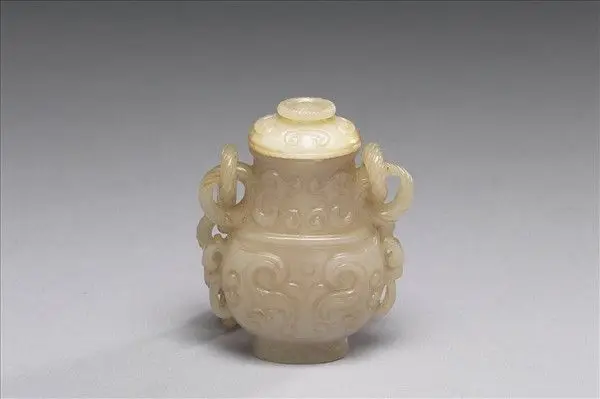 Jade vessel imitating bronze yu with moveable ring handles by Unknown artist