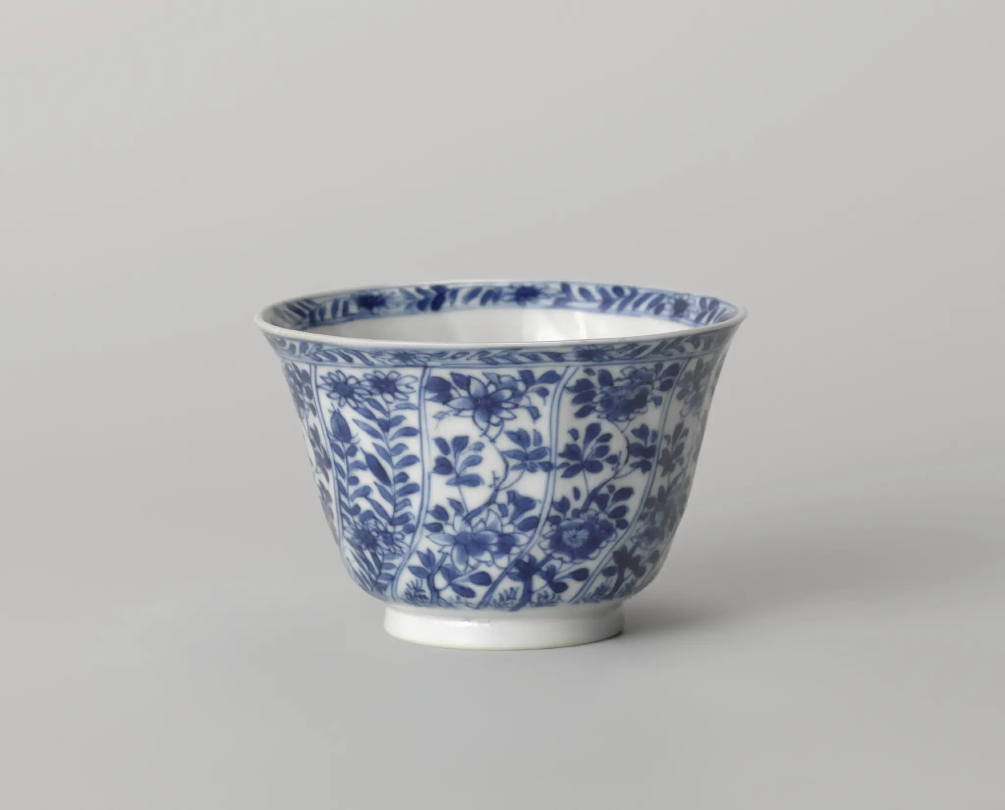 Cup with twisted panels with flower sprays by anonymous