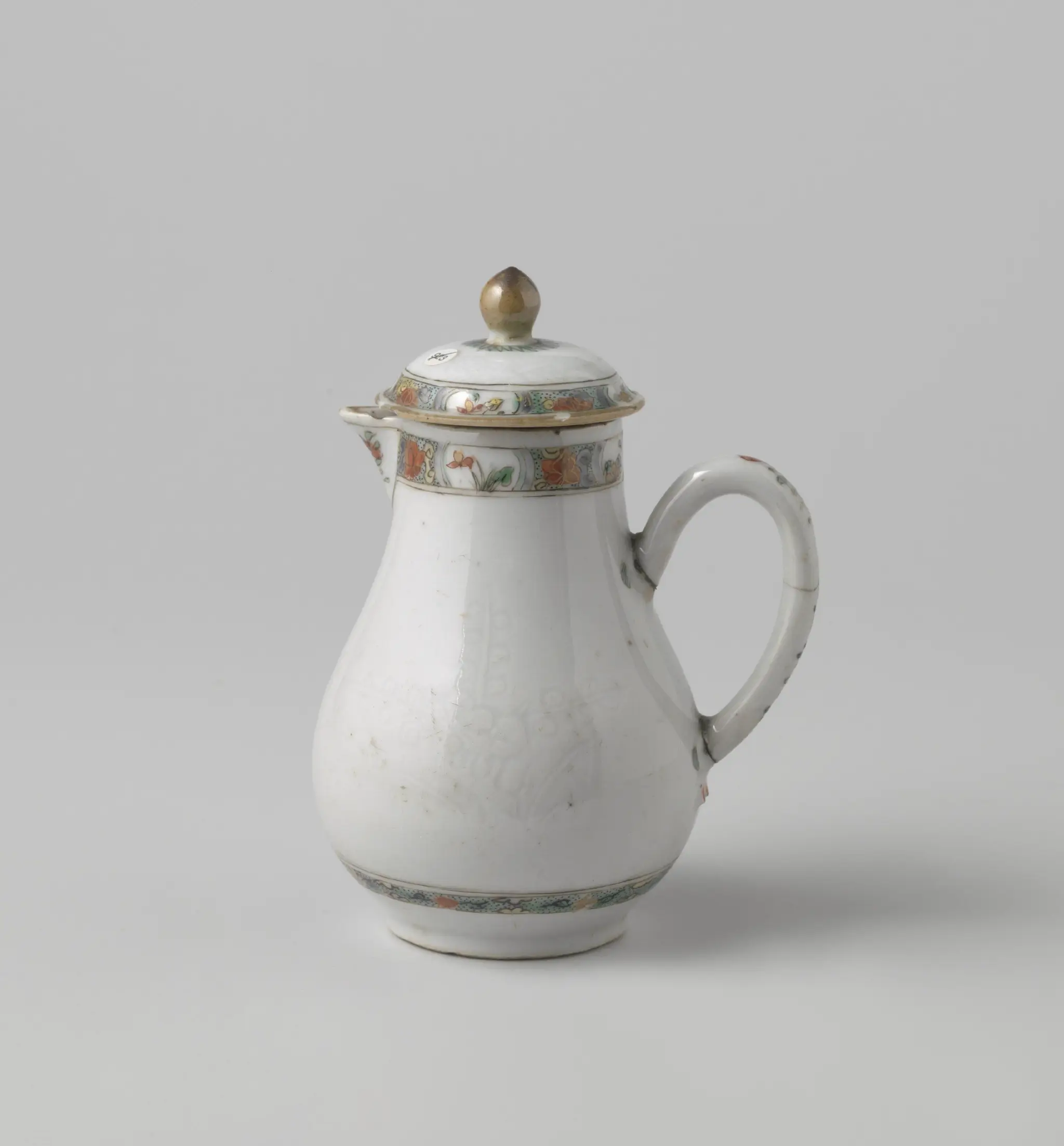 Milk jug with cover with onderglaze relief decoration with flowers by anonymous