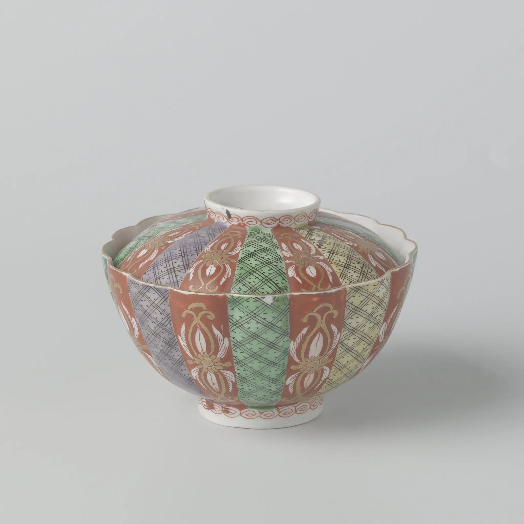 Covered bowl with scrolls, diaper pattern and scattered flowers by anonymous