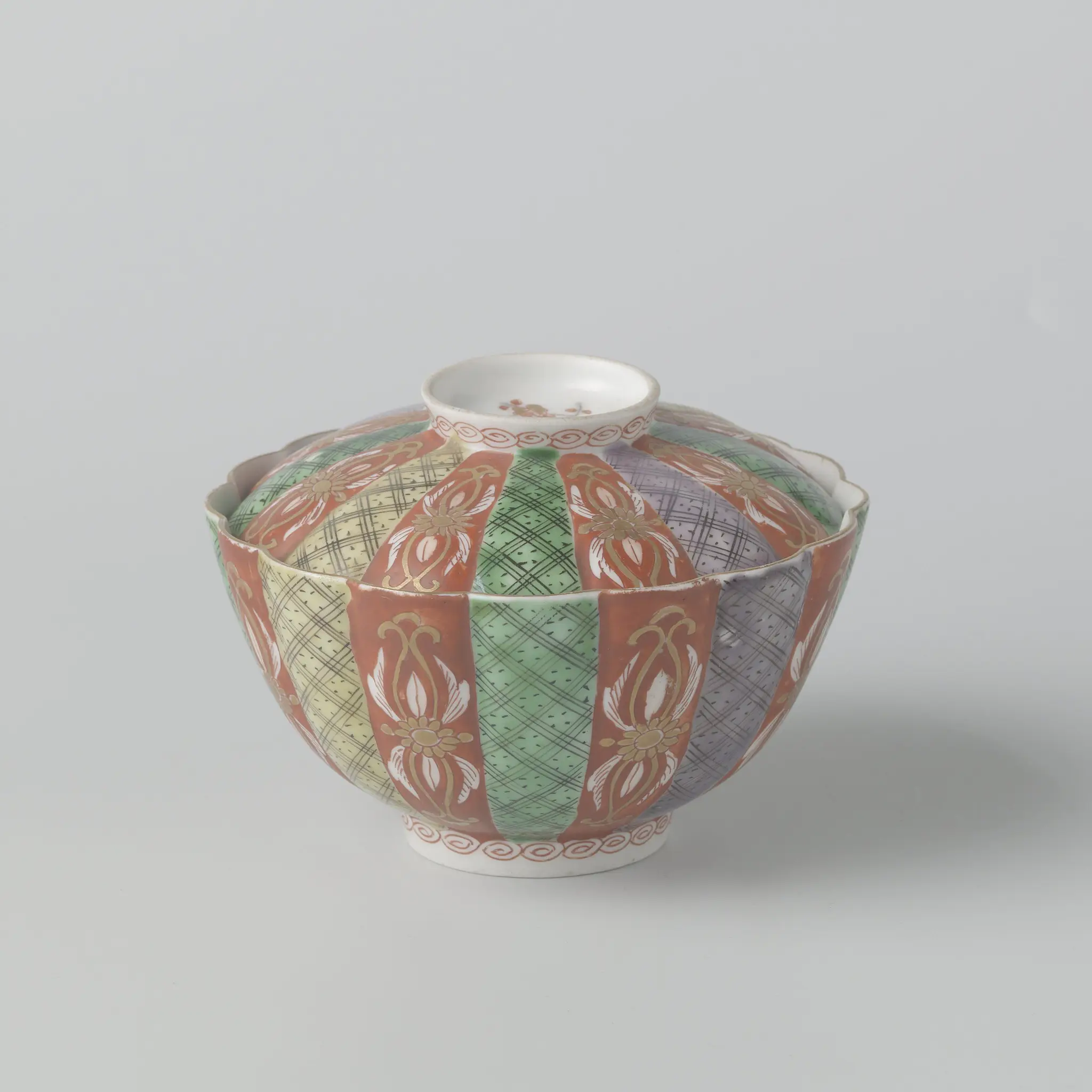 Covered bowl with scrolls, diaper pattern and scattered flowers by anonymous