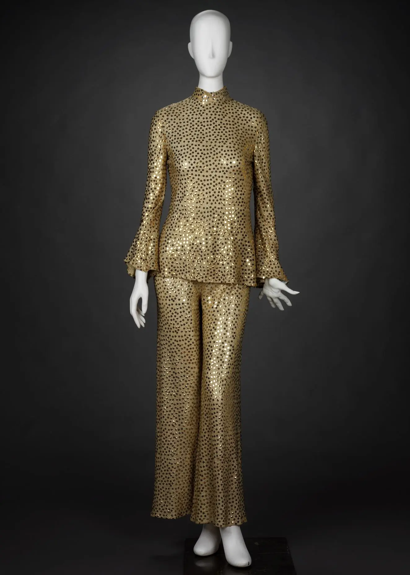 Gold sequin pantsuit by Mollie Parnis