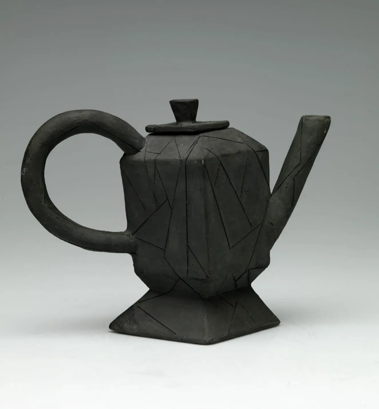 Two teapots in angled morning light. Black by Andrew Lord