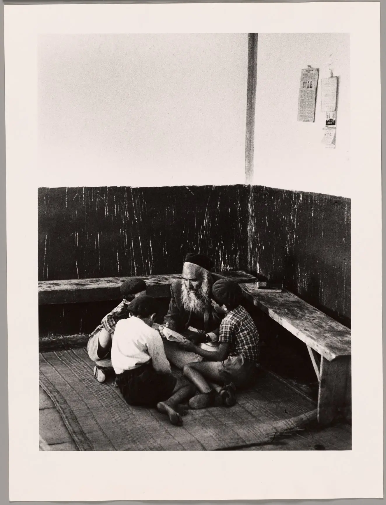 Untitled (Boys and man reading) by Micha Bar-Am