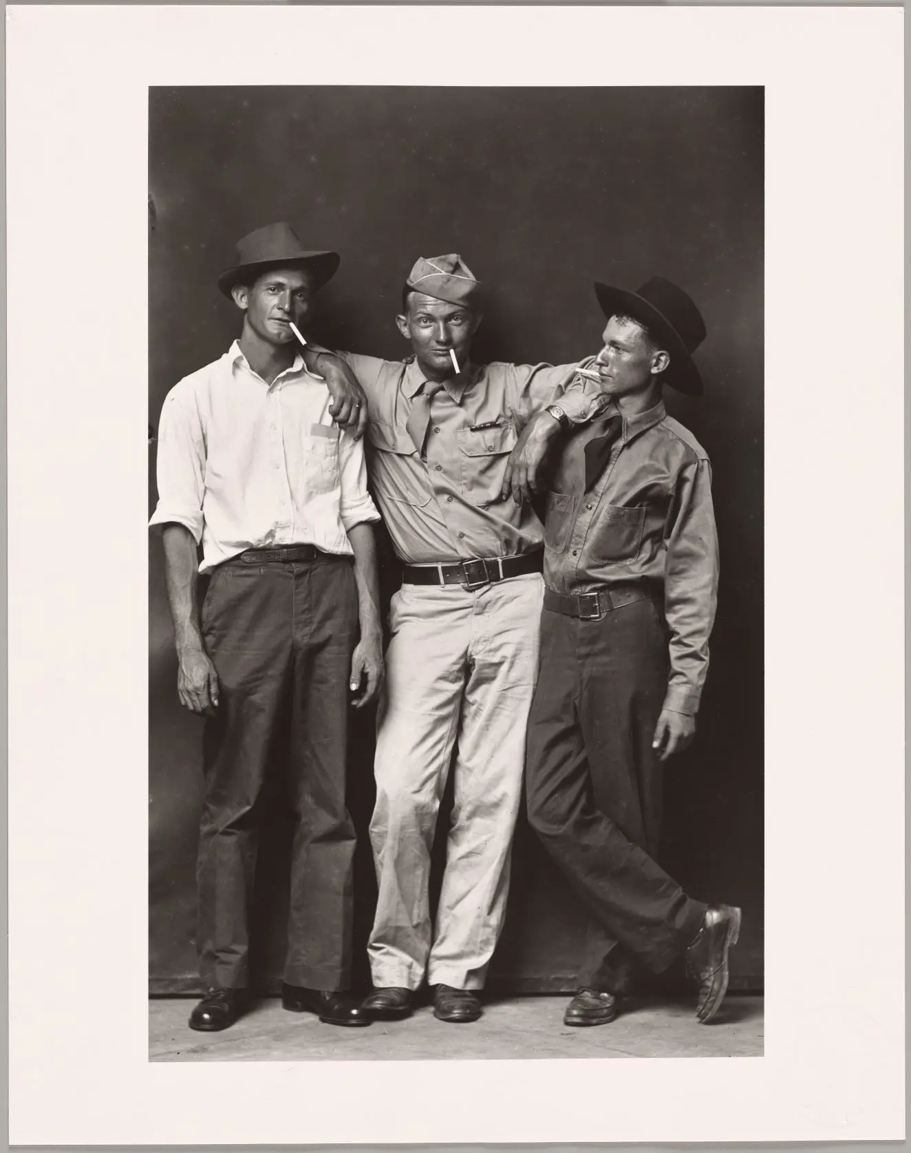 Untitled (soldier and two men) by Mike Disfarmer