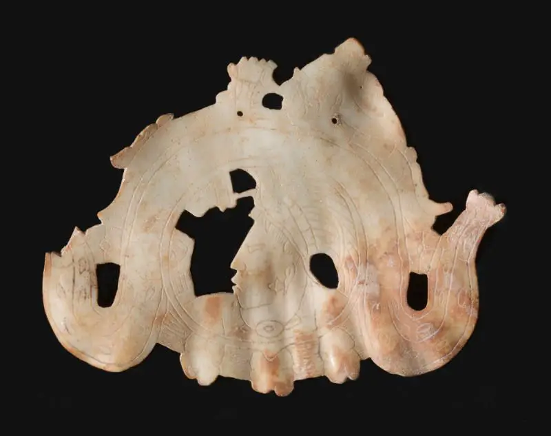 Shell pendant depicting a young lord, and the Jaguar god riding a serpent by Maya