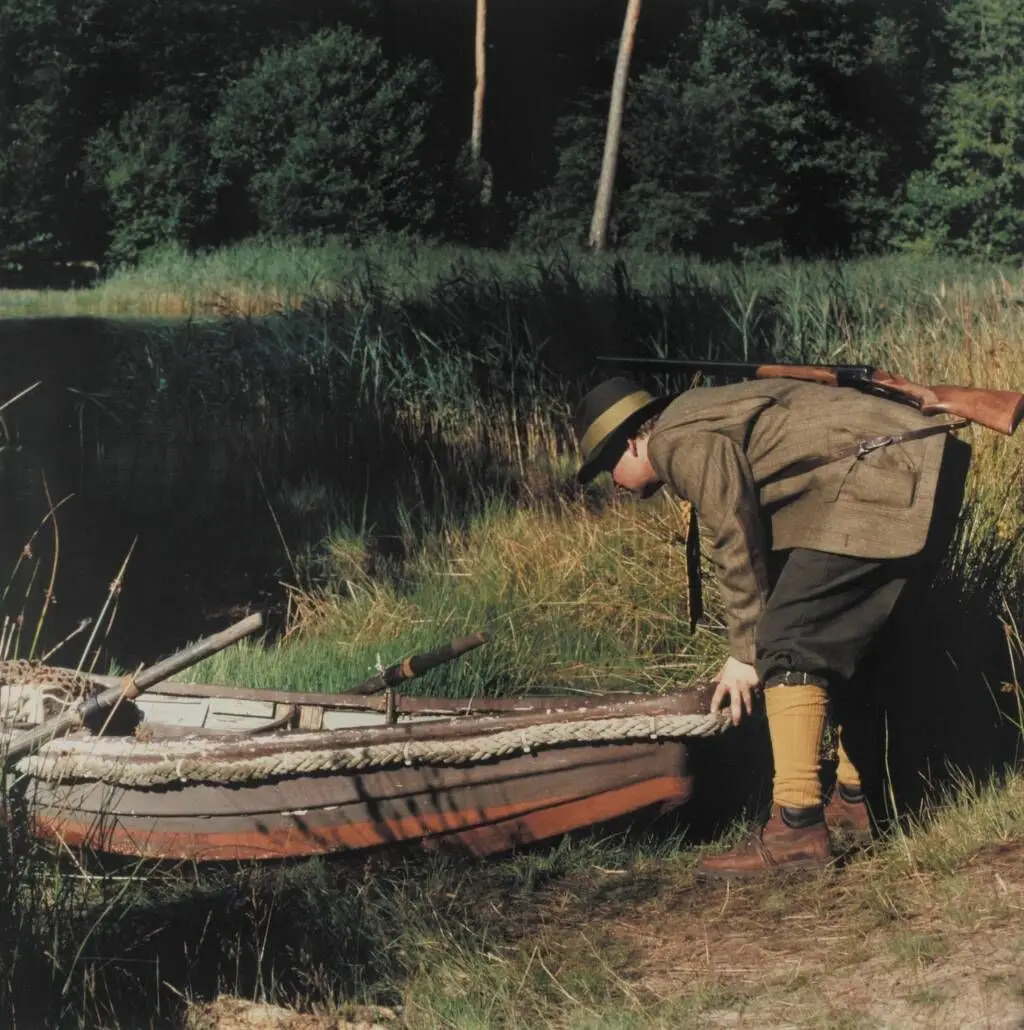 The Lake (The hunter pushes the boat from the bank of the lake) 7 by Peter Land