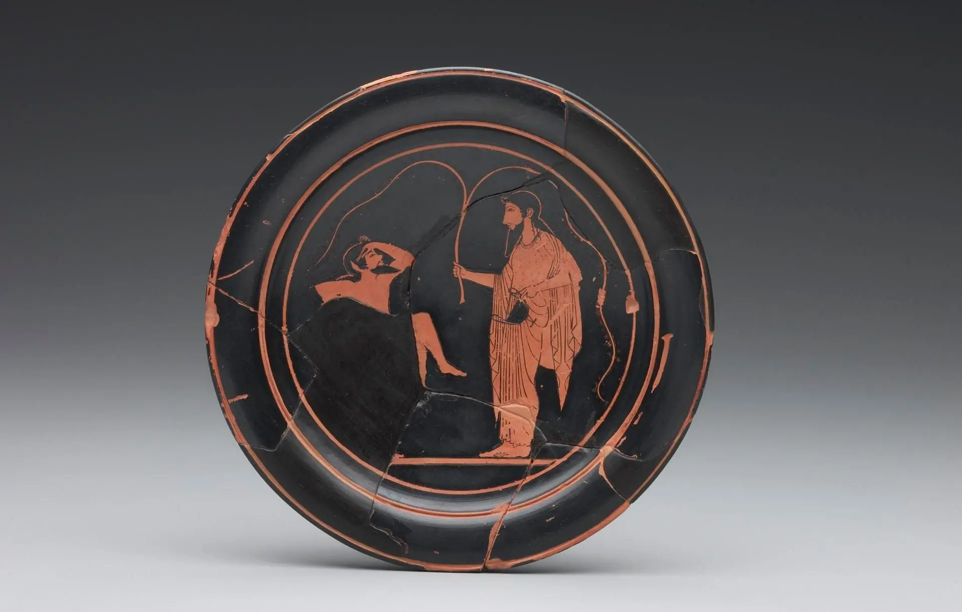Red-figure plate with Dionysos and a satyr by Artist: Paseas