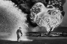 Greater Burhan Oil Field, Kuwait (Foam and Fire) by Artist: Sebastião Salgado